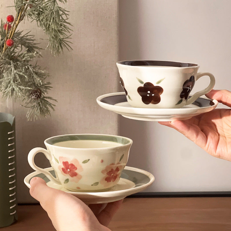 Holding Vintage Botanical Coffee Cups and saucers