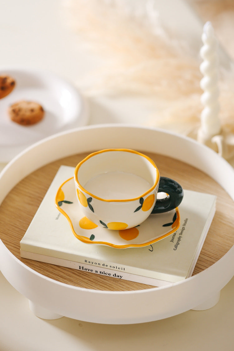 Colorful teatime cup and saucer - lemon top view