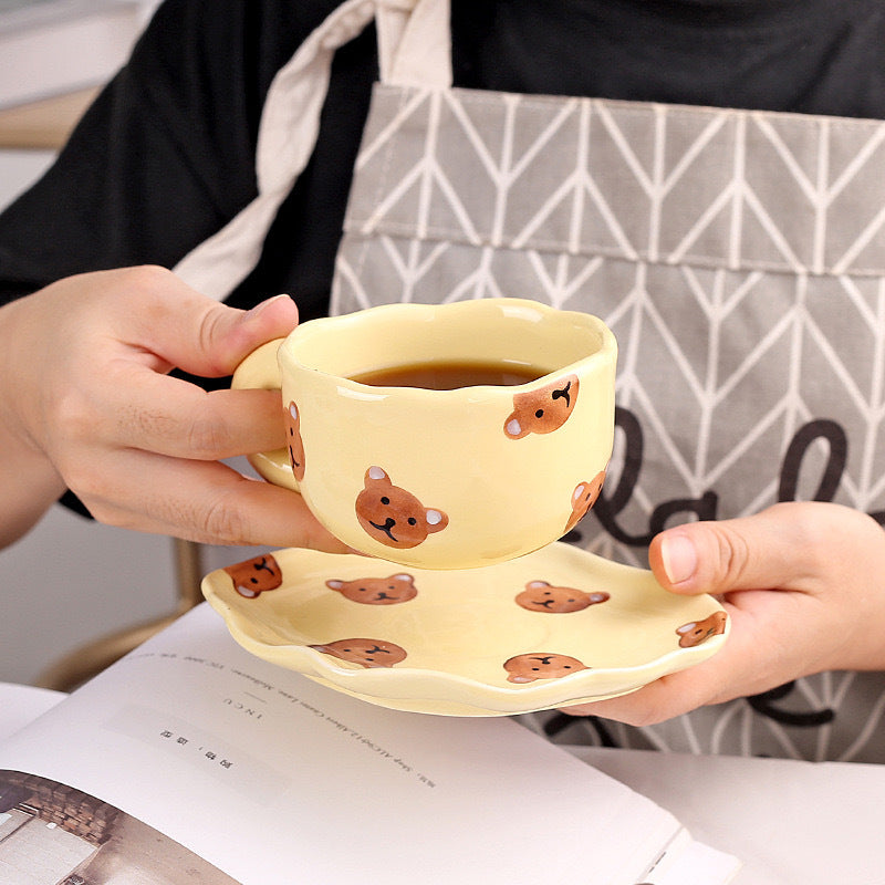 Colorful teatime cup and saucer - yellow bear side view